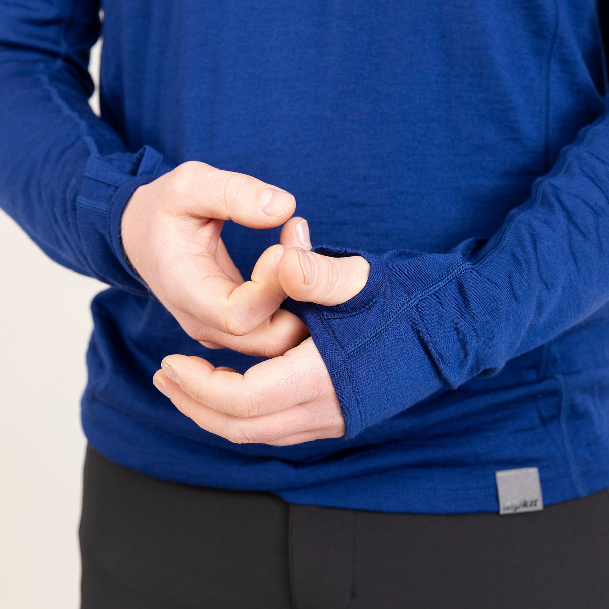 alpkit mens Kepler long sleeve merino baselayer in navy blue thumb loop cuff|tf