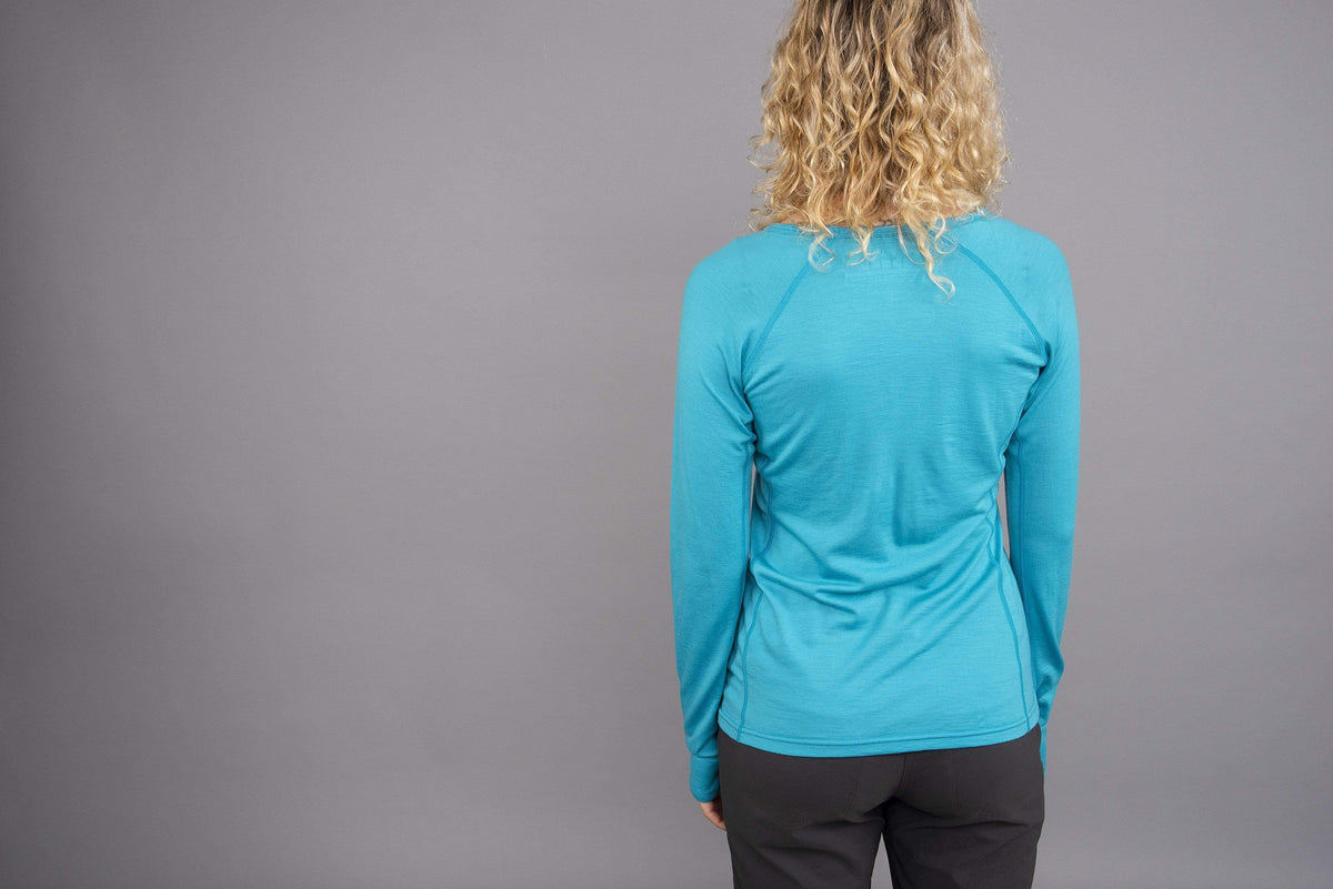 womens Kepler long sleeve merino baselayer in surf rear
