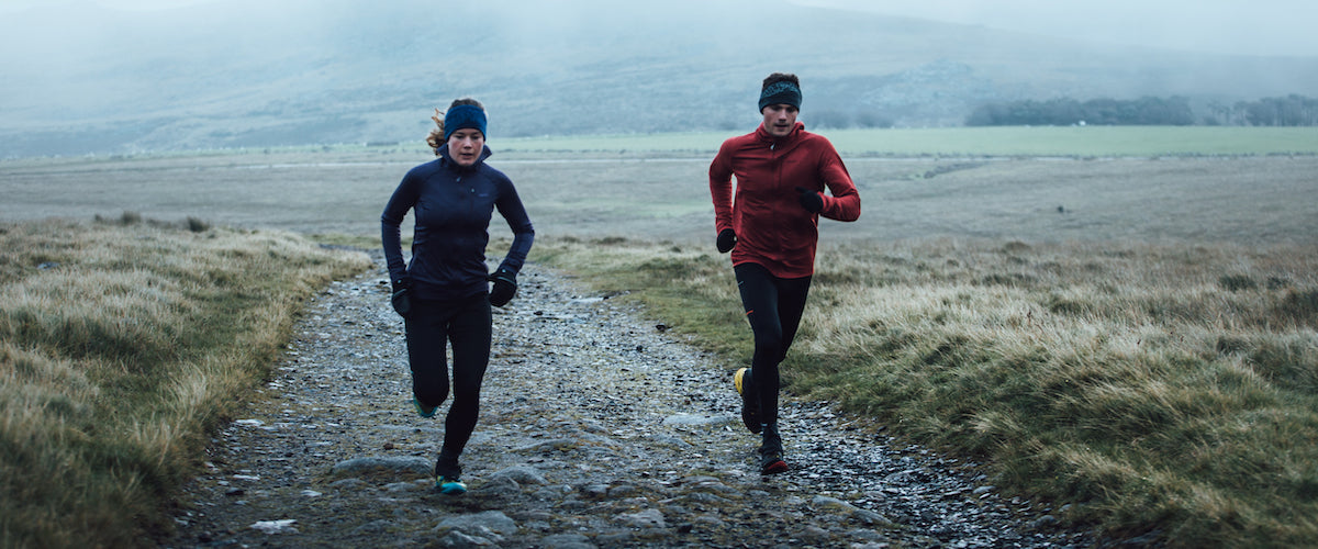 Man and woman running in Devon