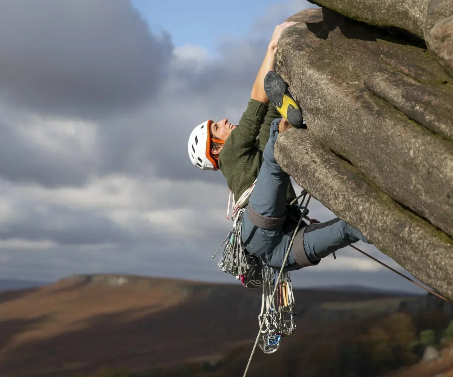 Climber on the Flying Butress overhang on Stanage