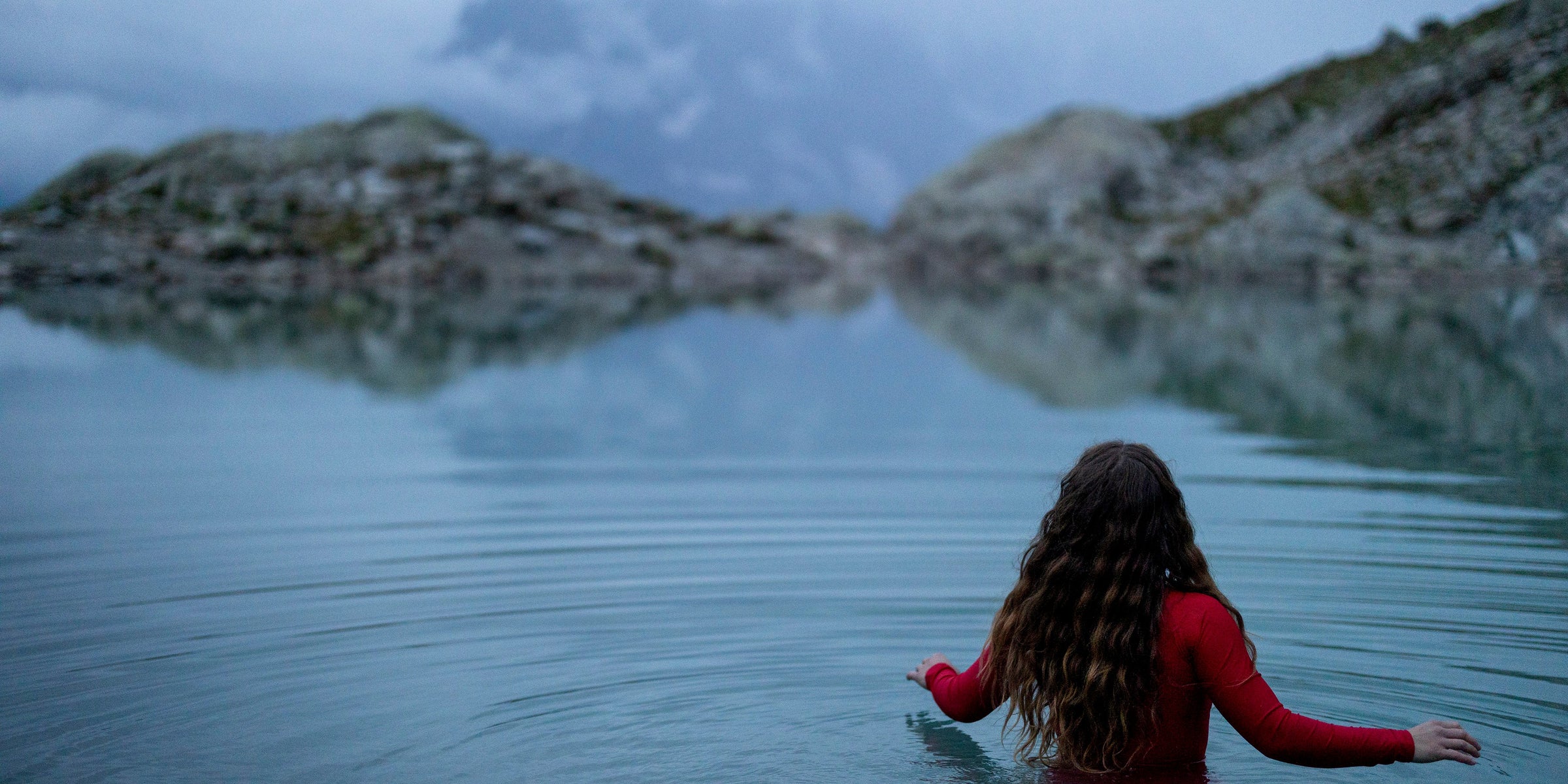 Wild swimming in a mountain lake