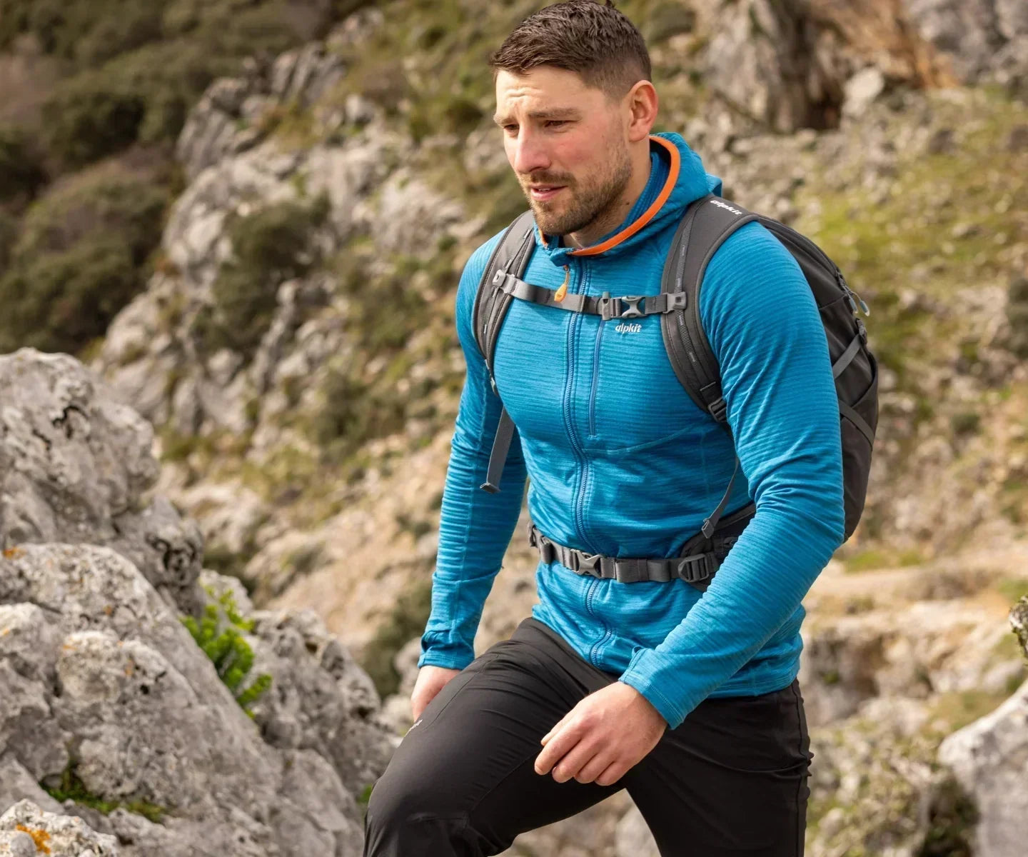 Hiker wearing a fleece mid layer