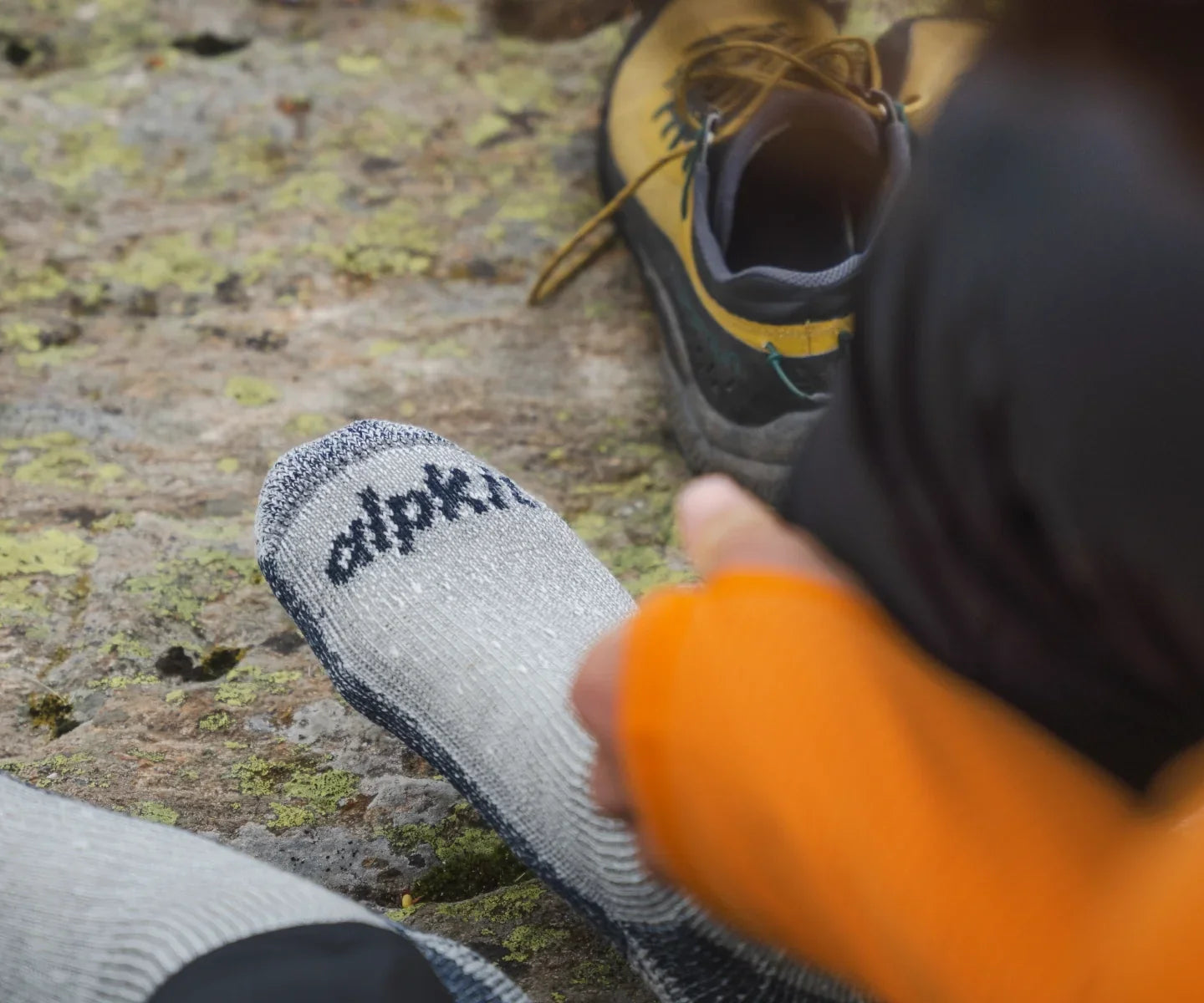 Hikers pulling on walking socks