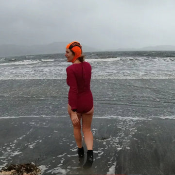 Winter outdoor swimmer dressed in dry robe