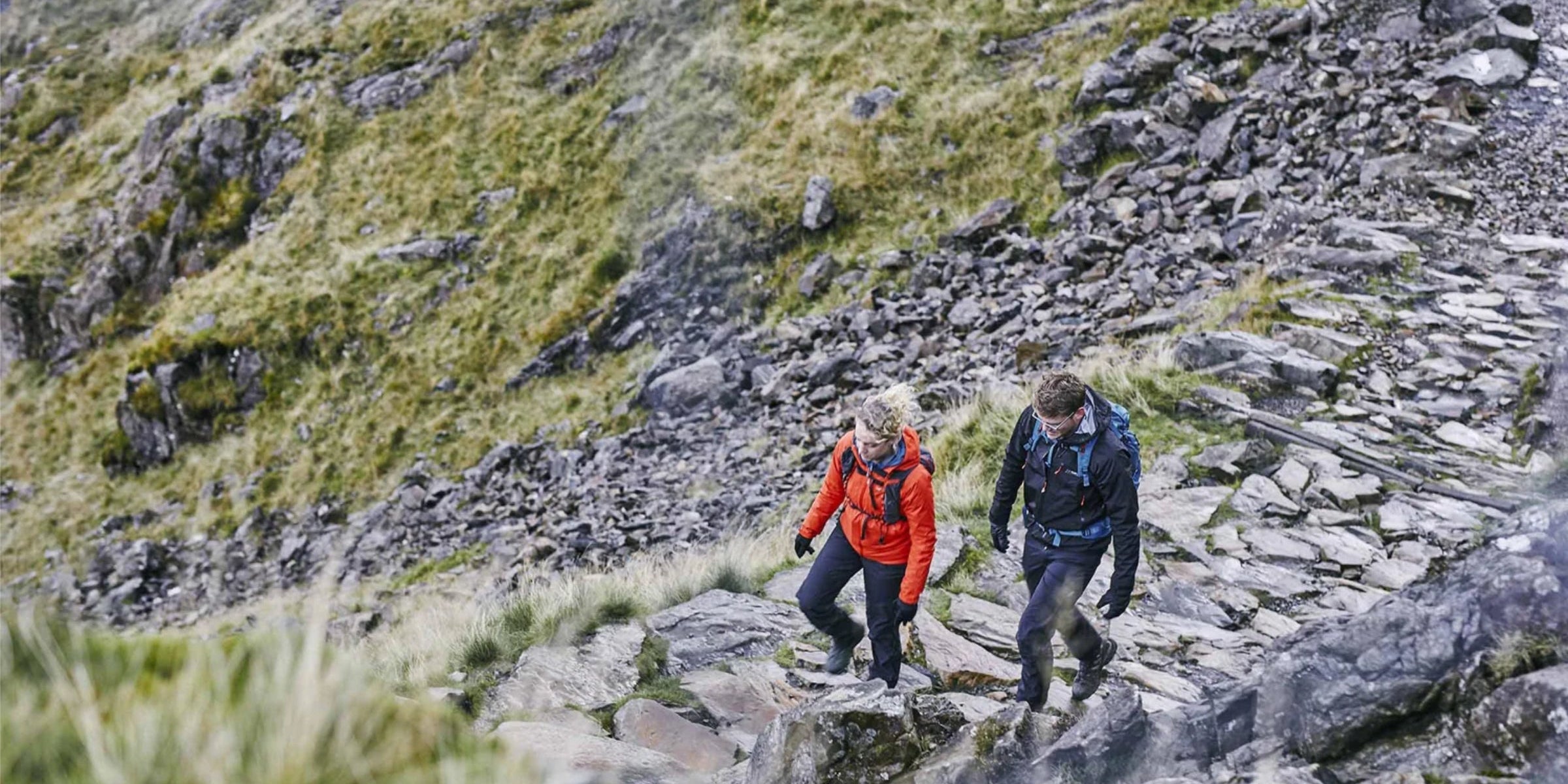 Hiking in rain wearing Nautilus waterproof trousers