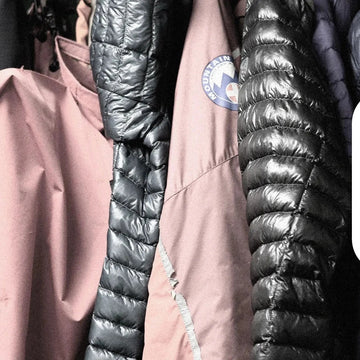 Climber wearing down jacket
