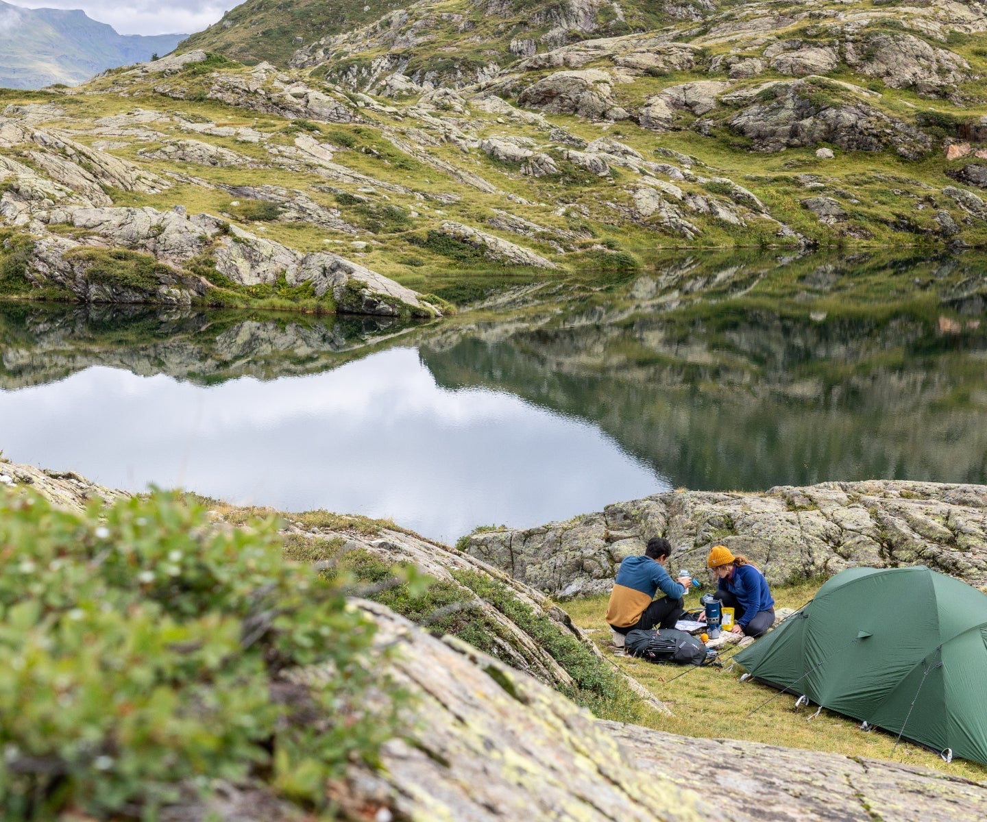 Wild camping by a lake in the mountains