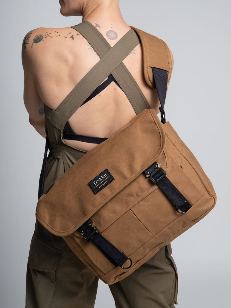 a woman with the bairn pro messenger on her back