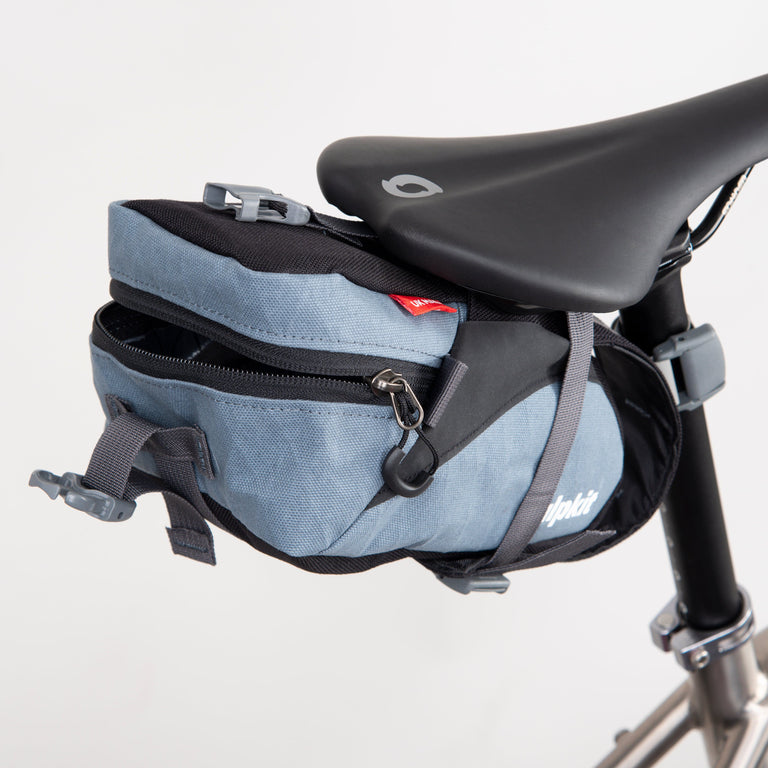 enduro seatpack regular bikepacking bag in storm grey open - closed