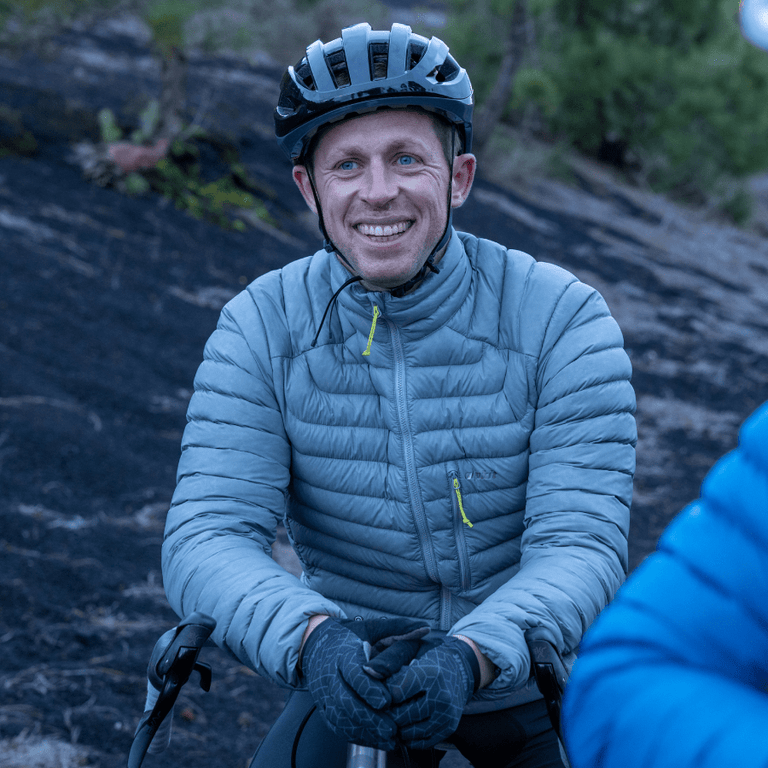 man wearing men's Alpkit Halogen down jacket - closed