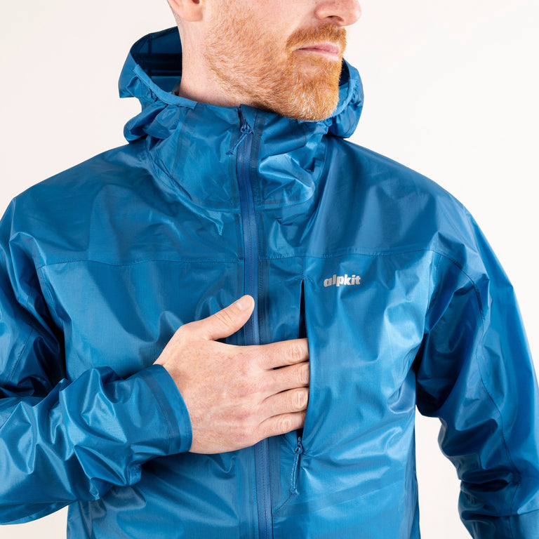 alpkit mens gravitas trail running fell running jacket in reef blue chest pocket