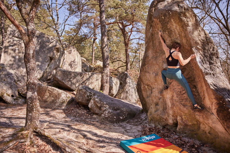 Zofia Reych bouldering in Font wearing green climbing tights - action