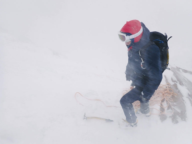 Climber Tom Ripley battling a snow storm - action