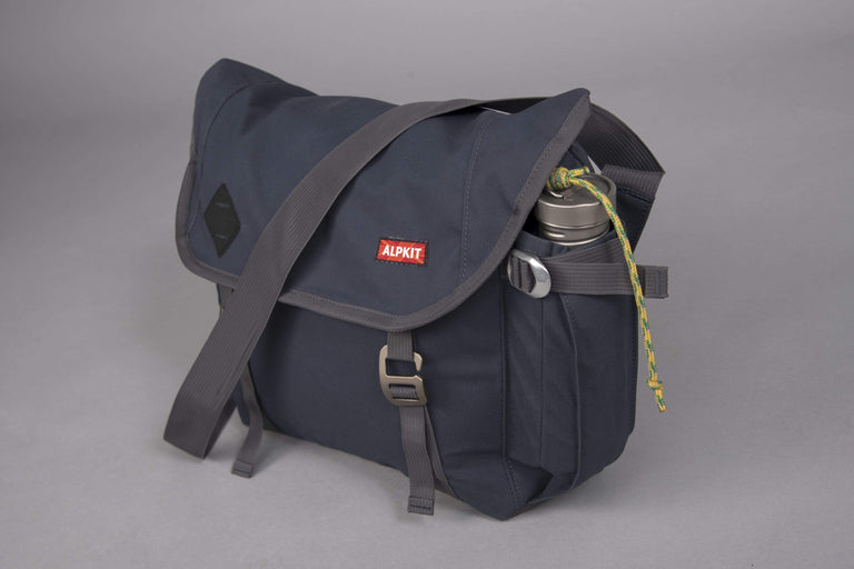 alleycat waxed cotton messenger bag in denim - closed