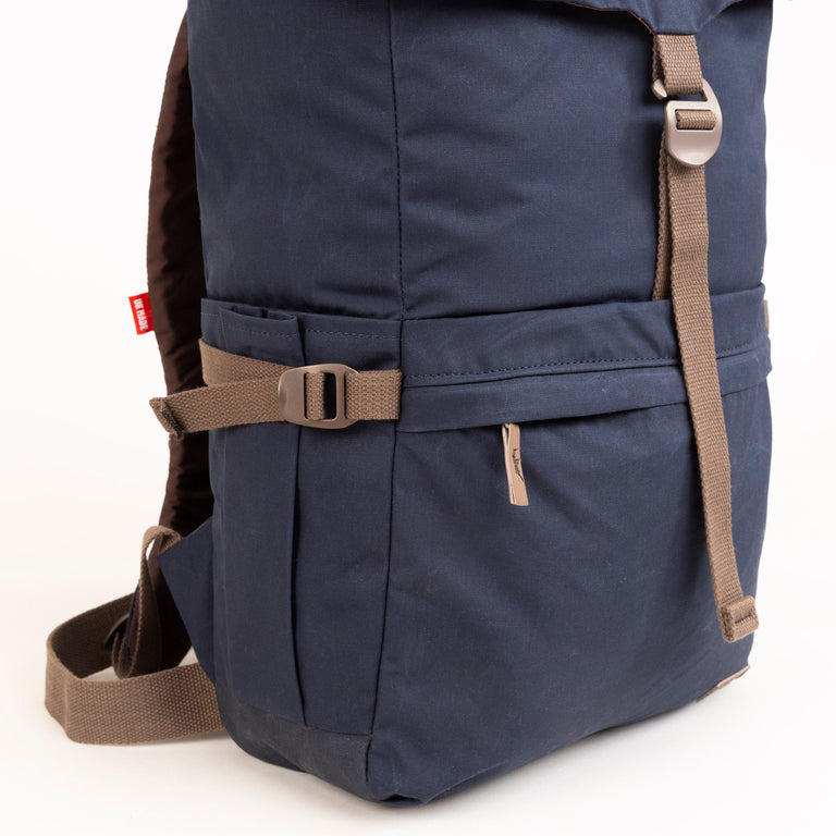 alpkit brevent backpack in navy zipped pocket