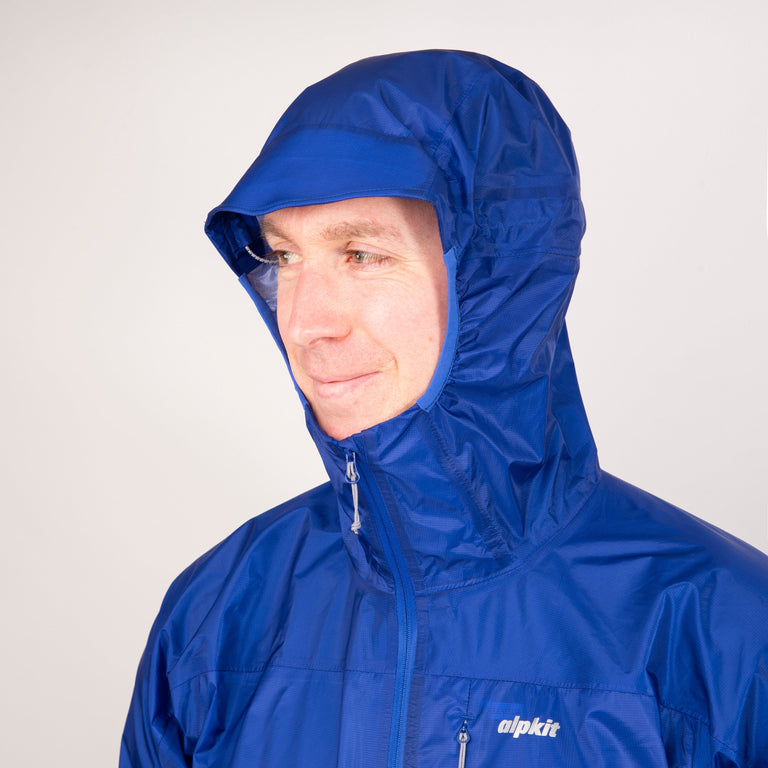 alpkit mens gravitas waterproof jacket in fontainebleau blue hood