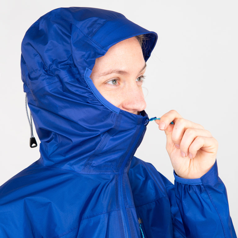 alpkit womens gravitas waterproof jacket in fontainebleau blue hood front