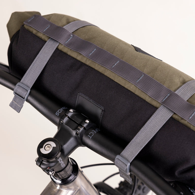 alpkit kuoka handlebar bag for bike packing in olive green logo patch