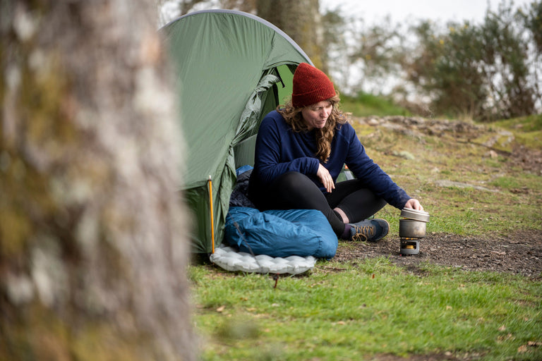 Jenny Graham bikepacking with an Aeronaut bikepacking tent and a PipeDream 400 ultralight down sleeping bag - action - closed