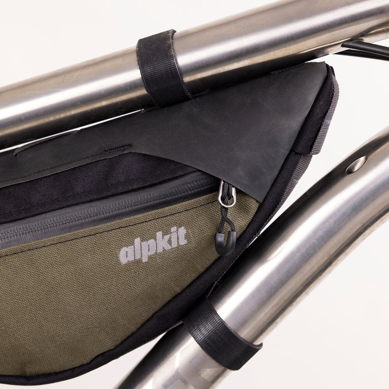 alpkit possum frame bag for bikepacking in olive green logo