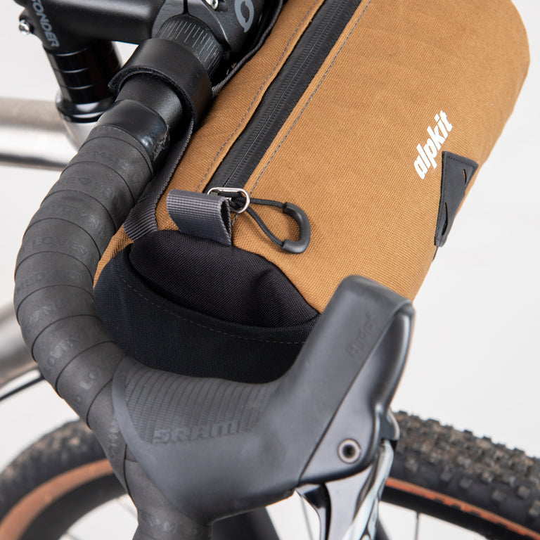 alpkit toploader zipped handlebar bag in mountain brown mesh pockets - closed