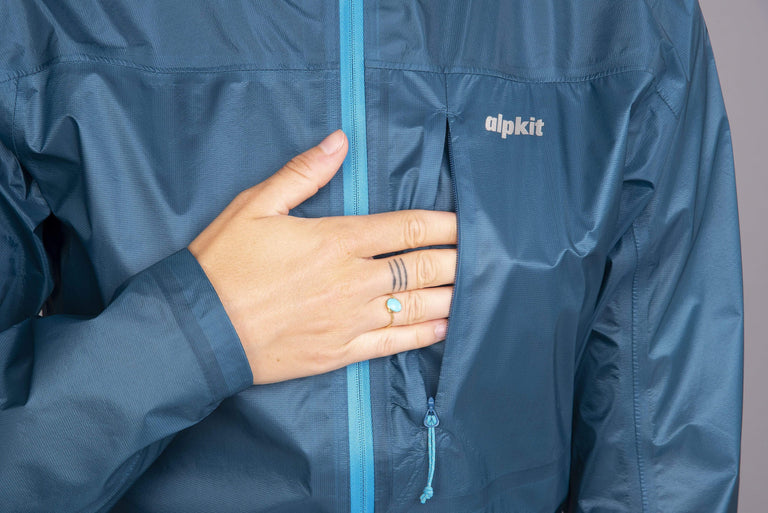 Alpkit womens Gravitas waterproof jacket in reef chest pocket